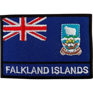 May include: A rectangular embroidered patch featuring the Falkland Islands flag with a blue background, a red and white Union Jack in the upper left corner, a central crest with a white sheep, and the text FALKLAND ISLANDS in white capital letters.