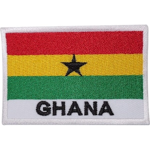 May include: A rectangular embroidered patch featuring the flag of Ghana with horizontal stripes of red, yellow, and green. A black five-pointed star is centered in the yellow stripe, and the word GHANA is stitched in black on a white base.