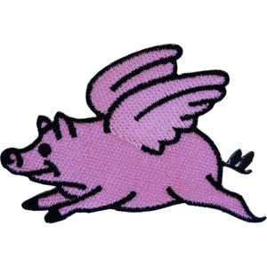 May include: An embroidered patch featuring a pink flying pig with black outlines. The pig is depicted in a side profile view with wings extended upwards, a small curly tail, and black hooves, showcasing a detailed stitched texture throughout.