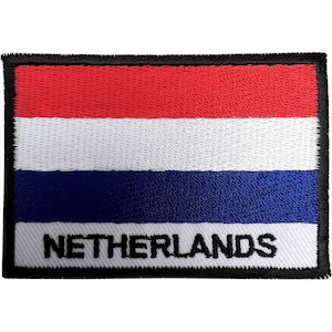 May include: A rectangular embroidered patch featuring the horizontal tricolour flag of the Netherlands with red, white, and blue stripes. The word NETHERLANDS is stitched in bold black capital letters across the bottom white stripe, bordered by black.
