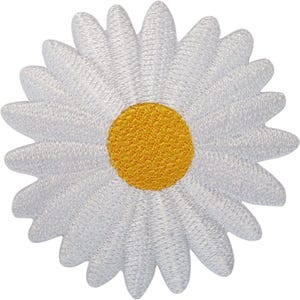 May include: A circular embroidered patch featuring a daisy flower design. The patch has a bright yellow circular centre surrounded by numerous long, thin, white petals radiating outward, all created with dense, textured thread stitching.
