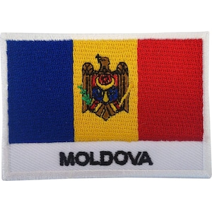 May include: A rectangular embroidered patch featuring the national flag of Moldova with vertical blue, yellow, and red stripes. The centre yellow stripe displays the Moldovan coat of arms, and the word MOLDOVA is stitched in black on a white border.