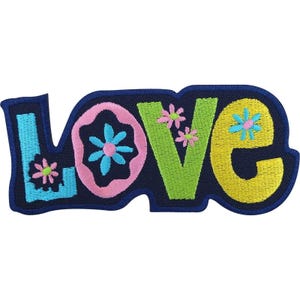 May include: An embroidered patch featuring the word LOVE in colourful block letters. The L is light blue with a pink flower, the O is pink with a blue flower, the V is lime green with two pink flowers, and the E is yellow with a blue flower.