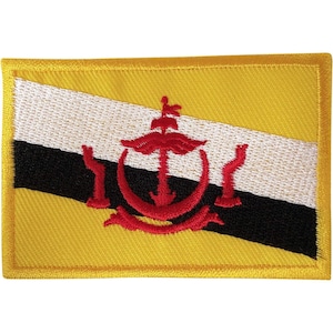 May include: A rectangular embroidered patch featuring the national flag of Brunei. The design consists of a yellow background with a white and black diagonal stripe and a red emblem centered in the middle, all finished with a yellow stitched border.