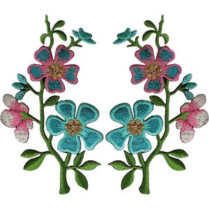 May include: Two symmetrical embroidered floral patches featuring green stems and leaves. Each patch displays a large pink and teal flower at the top, a large teal flower in the centre, and smaller pink and white buds on the outer side branches.