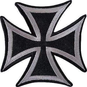 May include: An embroidered iron-on patch in the shape of an iron cross. The design features a solid black centre with a thick, silver-grey stitched border outlining the four flared arms of the cross, creating a high-contrast, symmetrical emblem.