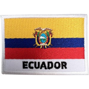 May include: A rectangular embroidered patch featuring the flag of Ecuador with horizontal yellow, blue, and red stripes. The national coat of arms is centered, and the word ECUADOR is stitched in bold black capital letters on the white base.