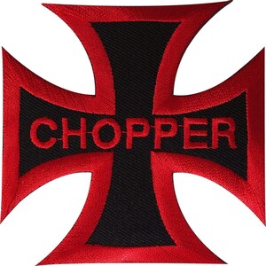 May include: An embroidered iron-on patch in the shape of an iron cross. The patch features a black center with a thick red border and the word CHOPPER stitched in red capital letters across the horizontal bar of the cross design.
