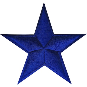 May include: A five-pointed star patch featuring a deep royal blue colour. The surface of the star displays a dense, textured embroidery pattern with visible stitching lines radiating from the centre towards each of the five sharp points.