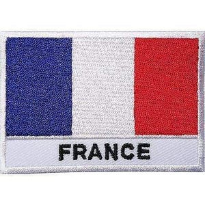 May include: A rectangular embroidered patch featuring the French flag with vertical stripes of blue, white, and red. Below the flag, the word FRANCE is stitched in bold black capital letters on a white background with a white border.