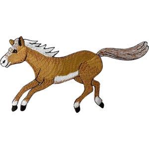 May include: An embroidered iron-on patch featuring a tan horse in a running pose. The horse has a white mane, a white tail, and white markings on its lower legs with black hooves. The embroidery uses shades of brown and white thread.