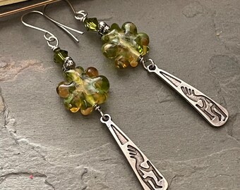 Kokopelli earrings, olive green lampwork glass flowers