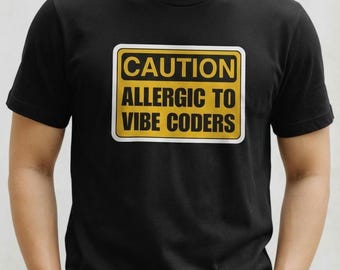 Camiseta con el mensaje "Precaución: Alérgico a las vibraciones, programadores", divertida camiseta con humor para desarrolladores.