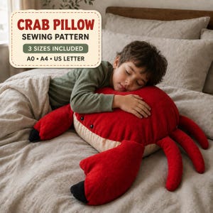 May include: A red and beige crab-shaped plush pillow with black accents on the claws and eyes. A text overlay reads: CRAB PILLOW SEWING PATTERN, 3 SIZES INCLUDED, A0, A4, US LETTER. The pillow is shown as a finished product for a sewing project.