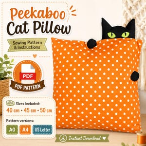 May include: A digital sewing pattern for a Peekaboo Cat Pillow featuring an orange square cushion with white polka dots and a black cat head with green eyes peeking over the top. Includes PDF instructions for 40 cm, 45 cm, and 50 cm sizes.