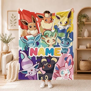 May include: A rectangular fleece blanket featuring a colorful collage of various Eevee evolution characters in a cartoon style. The center of the blanket displays the word NAME in large, bold, multi-colored letters against a white background.