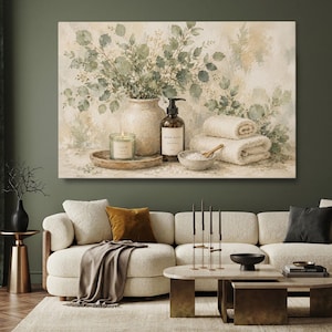 May include: A rectangular canvas wall art print featuring a beige vase filled with green eucalyptus branches, a glass candle labelled Calm, a brown pump bottle labelled Hand Wash, and two folded white towels next to a small bowl with a wooden spoon.
