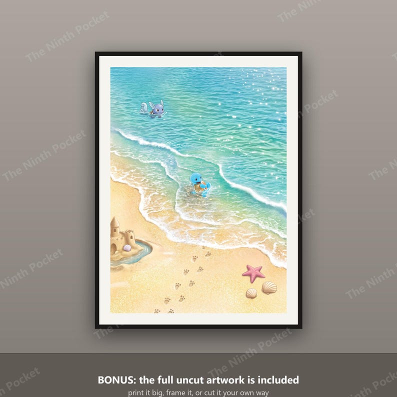 May include: A framed digital art print depicting a sunny beach scene with light blue ocean waves, a sandy shore, a sandcastle, a pink starfish, seashells, and footprints. Two small blue and purple creatures are playing in the shallow water.