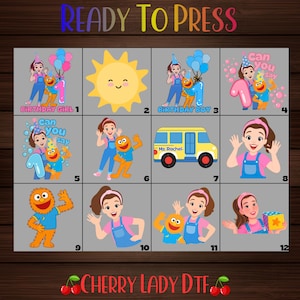 May include: A collection of twelve colorful DTF heat transfer designs featuring a cartoon woman in blue overalls, an orange monster, a yellow sun, and a yellow school bus labeled Ms. Rachel. The text Ready To Press and Cherry Lady DTF is visible.