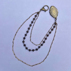 Medallón de bolsillo con triple cadena de bronce