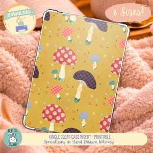 May include: A clear Kindle case insert featuring a repeating pattern of red, purple, and blue mushrooms on a mustard yellow background. The design includes small white speckles and dots. Text on the image reads: DOWNLOAD, 6 Sizes!, and KINDLE CLEAR CASE INSERT - PRINTABLE Specializing in Hand Drawn Whimsy.