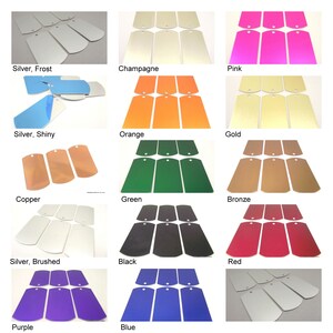 May include: A set of 12 blank metal tags in various colors, including silver, champagne, pink, orange, gold, copper, green, bronze, black, red, purple, and blue. The tags are all the same size and shape, with rounded corners and a hole at the top for attaching a string or ribbon.