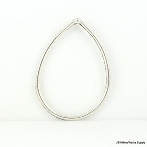 May include: A silver teardrop-shaped hoop earring with a smooth, rounded finish.