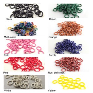 May include: Assortment of colorful rubber O-rings in various colors, including black, green, multi-color, orange, pink, purple, red, rust, white, and yellow.
