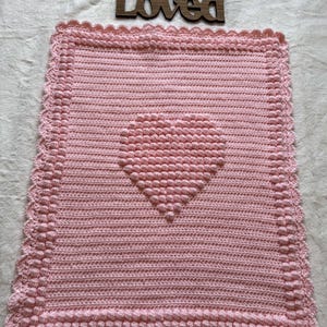 Baby blanket , pink heart blanket with soft bobbles in the shape of a heart. Beautiful gift .