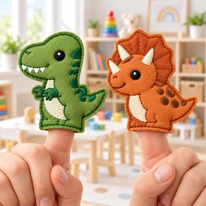 May include: Two felt finger puppets shaped like dinosaurs. One is a green Tyrannosaurus Rex with a white belly and black eyes. The other is an orange Triceratops with three white horns, a white belly, and dark brown spots on its back.
