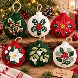 May include: Six round felt Christmas ornaments featuring embroidered botanical designs including pine branches, holly leaves, a red poinsettia, a white flower, mistletoe, and berries, each with a jute twine hanging loop.