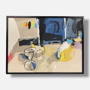 May include: A framed abstract print featuring a composition of bold shapes and lines in shades of blue, yellow, black, and beige. The artwork displays a series of vertical brushstrokes at the top and stylized vessel forms in the foreground.