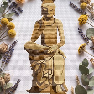 Peut inclure: Un motif de point de croix sur toile Aida blanche représentant une silhouette assise dans des tons de brun, beige et crème. Le design présente une personne stylisée avec des ombres géométriques, rendu dans un style pixelisé avec des points.