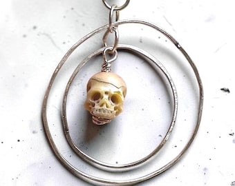 Concentric Circle Pendant with Hand Carved Pearl Skulls