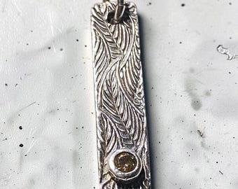 Silver Bar Pendant with Leaf Motif and a Topaz CZ