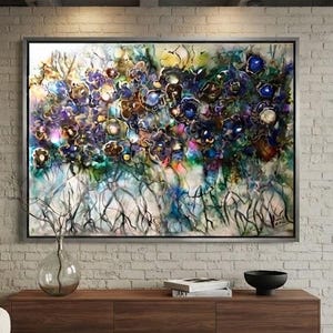 May include: A large rectangular framed wall art piece featuring an abstract floral composition with deep blues, purples, and gold accents. The painting displays layered organic shapes and dark, root-like lines at the bottom, set within a thin frame.
