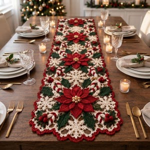 May include: A long, rectangular crochet table runner featuring a repeating pattern of red poinsettia flowers, green holly leaves, and white snowflakes. The design includes small red berries and candy cane motifs, finished with a scalloped red edge.