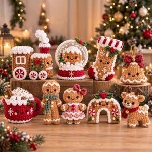 May include: A collection of crocheted Christmas ornaments including a gingerbread train, a snow globe, a stocking, a bell, a mug of cocoa, two gingerbread figures, a candy cane arch, and a reindeer, all featuring smiling faces and festive details.