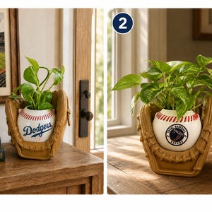May include: A tan baseball glove shaped planter holding a green plant, featuring a white baseball with red stitching in the center. The first planter displays the blue Dodgers logo, while the second planter features a circular Total Baseball Vipers logo.