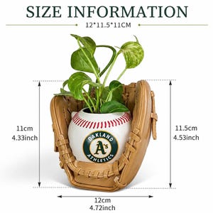 May include: A tan baseball glove planter holding a white baseball-shaped pot with red stitching and the Oakland Athletics logo. The dimensions are 12 inches by 11.5 inches by 11 inches, with a height of 4.33 inches to 4.53 inches and width of 4.72 inches.