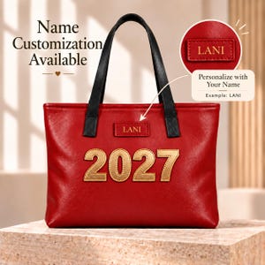 May include: A red tote bag with black handles featuring the gold numbers 2027 on the front and a rectangular patch with the name LANI. Text on the image includes Name Customization Available and Personalize with Your Name Example LANI.