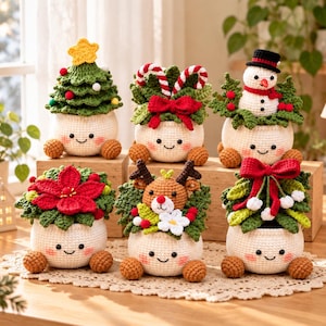 May include: Six crocheted planters with smiling faces, each featuring different holiday themes including a Christmas tree, candy canes, a snowman, a poinsettia, a reindeer, and mistletoe, all set in cream-colored pots with small brown feet.