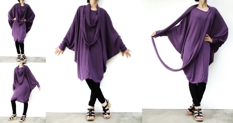 Puede incluir: Una t&uacute;nica larga, de color morado, con cuello de pico y mangas largas. Las mangas est&aacute;n fruncidas en las mu&ntilde;ecas y la t&uacute;nica es de corte holgado. La modelo lleva pantalones negros y sandalias.