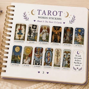 May include: A spiral-bound sticker sheet titled TAROT WORDS STICKERS Sheet 3: The Next 12 Cards. It features twelve rectangular tarot card stickers with classic illustrations and a text box stating, The cards don't predict the future, they help you create it.