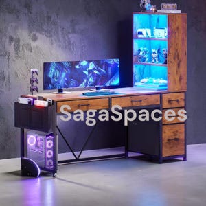 May include: A gaming desk with a wood-grain finish and black metal frame, featuring a hutch with blue LED lighting, two drawers, a side cabinet with three drawers, a computer tower compartment, and a monitor displaying a digital graphic.
