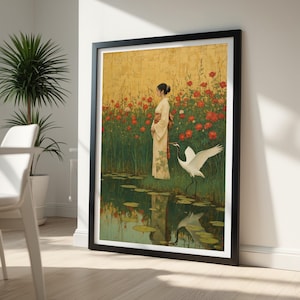 May include: A framed wall art print featuring a person in a cream-colored kimono standing in a field of red poppies near a pond. A white crane with black markings stands in the foreground, and the scene is set against a textured gold background.