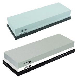 May include: Two rectangular sharpening stones mounted on black bases. The top stone is light blue with 400# and 1000# grit markings. The bottom stone is grey and white with 1000 and 4000 grit markings. Both stones have a flat, uniform surface.