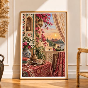 May include: A framed vertical art print depicting a balcony scene at sunset with a view of a distant city across water. The foreground features a table with a red patterned cloth, a tea set, a vase of flowers, and vibrant pink bougainvillea.