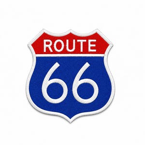 May include: A shield-shaped embroidered patch featuring the text ROUTE in white on a red background above the number 66 in white on a blue background, all outlined with a thick white border, mimicking the classic American highway road sign.