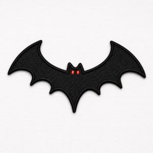 May include: A black embroidered bat patch featuring a textured surface and two small, bright red eyes. The bat is depicted with its wings fully spread in a symmetrical shape, showcasing detailed stitching along the edges of the wings.